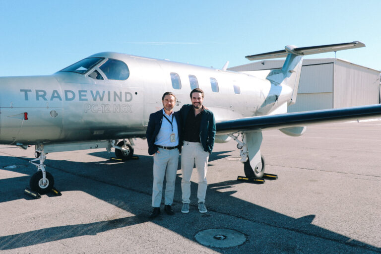 Adam Deflorian and David Zipkin in front of a Tradewind Pilatus PC-12 for a recording of the Luxury Travel Innovators podcast at Million Air FBO at Westchester County Airport.