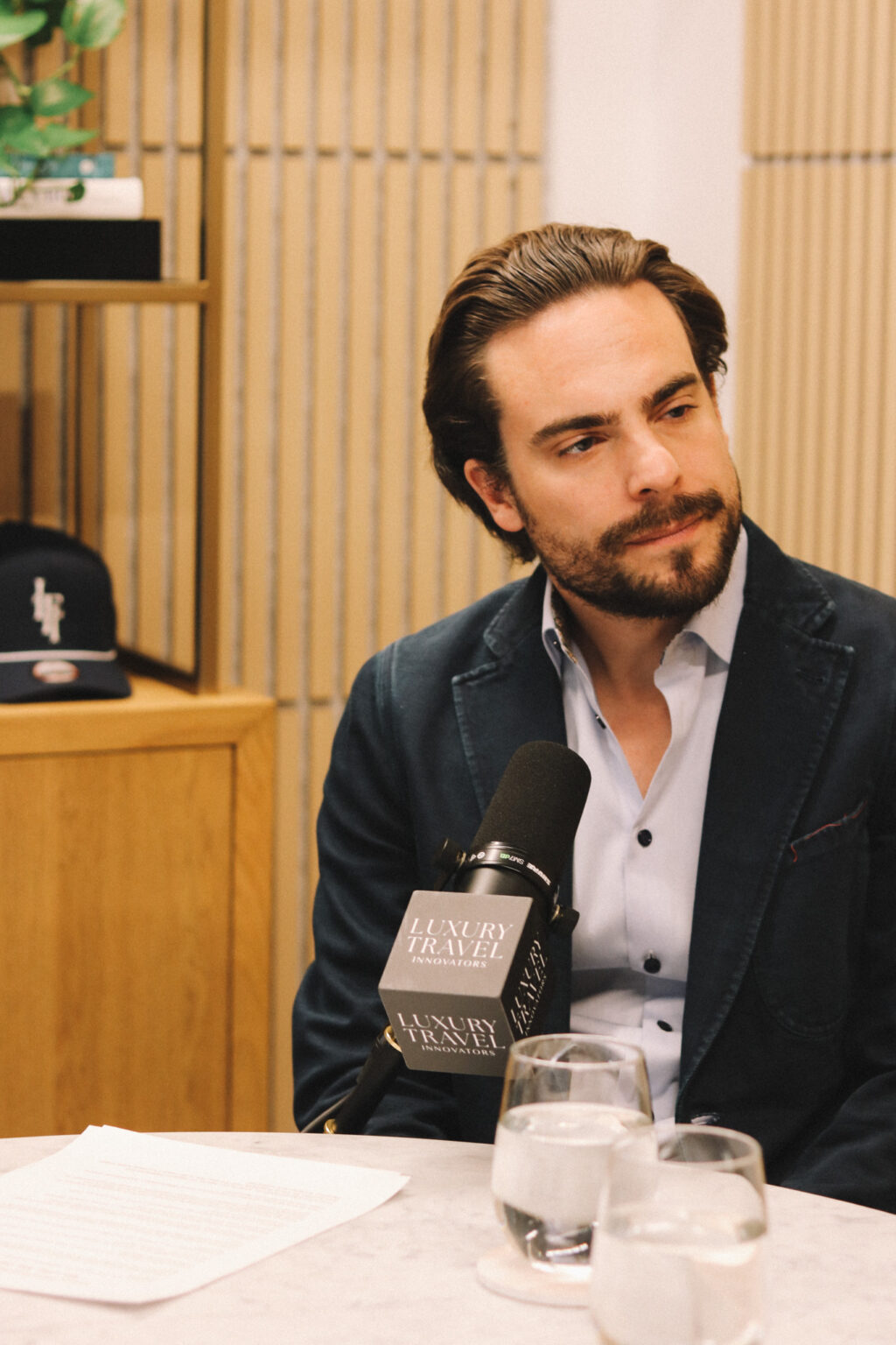 Adam Deflorian recording episode 34 of the Luxury Travel Innovators podcast.